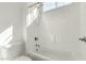 Clean and bright bathroom with a shower over tub and window at 1143 N Quinn --, Mesa, AZ 85205