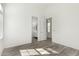 Neutral bedroom with a bathroom, window and light wood floors at 1143 N Quinn --, Mesa, AZ 85205