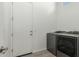 Laundry room featuring a washer and dryer, plus a door at 1143 N Quinn --, Mesa, AZ 85205