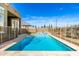 A pristine pool featuring a safety fence and desert landscaping at 1143 N Quinn --, Mesa, AZ 85205