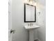 Powder room featuring a pedestal sink and black framed mirror at 1143 N Quinn --, Mesa, AZ 85205