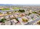 Expansive aerial view of a residential community with nearby sports fields and mountain views at 11843 W Cambridge Ave, Avondale, AZ 85392