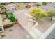 Aerial view of a home showcasing a well-maintained lawn and outdoor living space at 11843 W Cambridge Ave, Avondale, AZ 85392