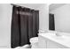 Bathroom featuring a vanity and a shower with a dark curtain at 11843 W Cambridge Ave, Avondale, AZ 85392