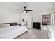 Spacious bedroom featuring a ceiling fan and neutral carpet at 11843 W Cambridge Ave, Avondale, AZ 85392