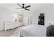 Bright bedroom with neutral tones, ceiling fan, and a walk-in closet at 11843 W Cambridge Ave, Avondale, AZ 85392