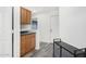 Hallway features wood-look floors, cabinets, and an open doorway at 11843 W Cambridge Ave, Avondale, AZ 85392