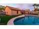 Backyard pool and turf provides outdoor enjoyment at 11843 W Cambridge Ave, Avondale, AZ 85392