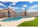 Backyard pool and artificial turf provides outdoor enjoyment at 11843 W Cambridge Ave, Avondale, AZ 85392