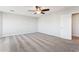 Upstairs bedroom featuring neutral carpet, ceiling fan, and bright natural light at 1200 E Country Crossing Way, San Tan Valley, AZ 85143