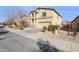 Inviting two-story home boasting a neutral stucco exterior, well-manicured landscaping, and a convenient two-car garage at 1200 E Country Crossing Way, San Tan Valley, AZ 85143