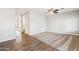 Bright living room showcasing plush carpet, wood-look floors, neutral walls, and an open doorway at 1200 E Country Crossing Way, San Tan Valley, AZ 85143