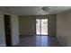 Living room featuring sliding glass doors and tile floors at 12245 N 21St Ave # 4, Phoenix, AZ 85029