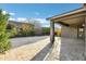 Inviting outdoor covered patio featuring tiled flooring, creating a cozy and functional living area at 123 W Sweet Shrub Ave, San Tan Valley, AZ 85140