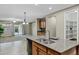 Spacious kitchen island that opens to the living area with a view of sliding glass doors at 123 W Sweet Shrub Ave, San Tan Valley, AZ 85140