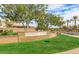 Ironwood Crossing's landscaping welcomes you home with beautiful green spaces and tree-lined streets at 123 W Sweet Shrub Ave, San Tan Valley, AZ 85140