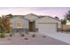 Charming single-Gathering home with stone accents and a two-car garage at 12638 W Parkway Ln, Avondale, AZ 85323