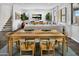 Open concept living room with wooden dining table, large windows, and modern decor at 12647 W Parkway Ln, Avondale, AZ 85323