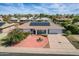 Aerial view of a well-maintained home showcasing a charming brick patio and solar panels, enhancing energy efficiency at 13019 N 98Th Ave, Sun City, AZ 85351