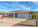 Lovely single-story home showcasing a two-car garage, solar panels, and well-kept landscaping at 13019 N 98Th Ave, Sun City, AZ 85351