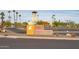 A welcome sign for Sun City West's RH Johnson Recreation Center with lush palm trees and inviting scenery at 13404 W Copperstone Dr, Sun City West, AZ 85375