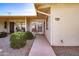 Inviting front entrance showcasing desert landscaping, a sidewalk, and a cozy porch with seating at 13404 W Copperstone Dr, Sun City West, AZ 85375