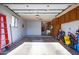 The garage has some cabinets and a ladder at 13404 W Copperstone Dr, Sun City West, AZ 85375