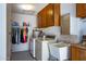 This laundry room has a washer, dryer, and sink at 13404 W Copperstone Dr, Sun City West, AZ 85375