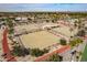 Aerial photo shows the outdoor Lawn Bowling area with seating and lush desert landscaping at 13404 W Copperstone Dr, Sun City West, AZ 85375