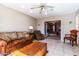 Cozy living room with tiled flooring and entry to Main Bedroom at 13404 W Copperstone Dr, Sun City West, AZ 85375