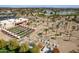 Aerial view of the community's attractive miniature golf course, lush landscaping, seating and nearby golf course at 13404 W Copperstone Dr, Sun City West, AZ 85375