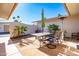 Enjoy outdoor dining on this patio with a table and chairs at 13404 W Copperstone Dr, Sun City West, AZ 85375