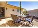 Enjoy outdoor dining on this patio with a table and chairs at 13404 W Copperstone Dr, Sun City West, AZ 85375