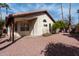 Exterior elevation showing a covered patio and desert landscaping at 15431 S 36Th Pl, Phoenix, AZ 85044