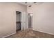 Carpeted bedroom featuring a closet and an adjoining bathroom at 15431 S 36Th Pl, Phoenix, AZ 85044