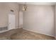 Bright living room features neutral carpet, tile entryway, and a view to another room through an archway at 15431 S 36Th Pl, Phoenix, AZ 85044