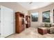 Well-lit home office featuring custom cabinetry and a beautiful view at 15501 E Tepee Dr, Fountain Hills, AZ 85268