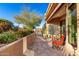 Desert home patio with glass brick, tile surface, desert landscaping, and mountain views at 15501 E Tepee Dr, Fountain Hills, AZ 85268