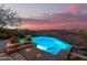 Inviting pool area with scenic desert and mountain views at twilight at 15501 E Tepee Dr, Fountain Hills, AZ 85268