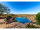 Desert home with a pool featuring an infinity edge and views of the surrounding desert landscape at 15501 E Tepee Dr, Fountain Hills, AZ 85268