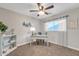 Bedroom featuring a ceiling fan, carpet, a desk, and coordinated decor at 16239 N 47Th Dr, Glendale, AZ 85306