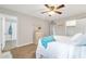 Well-lit bedroom featuring a ceiling fan, a closet, and a dresser at 16239 N 47Th Dr, Glendale, AZ 85306