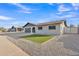 Attractive single-story home with well-maintained front yard and a two-car garage at 16239 N 47Th Dr, Glendale, AZ 85306