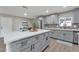 Spacious kitchen featuring stainless steel appliances, sleek countertops, and stylish finishes at 16239 N 47Th Dr, Glendale, AZ 85306