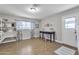 Multipurpose room with laundry, desk space, and decorative shelving with tile flooring at 16239 N 47Th Dr, Glendale, AZ 85306