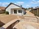 Spacious backyard featuring an outdoor fire pit and a stone path at 1805 E Bluefield Ave, Phoenix, AZ 85022