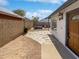 Spacious backyard featuring an outdoor fire pit and a stone path at 1805 E Bluefield Ave, Phoenix, AZ 85022