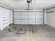 An empty garage with a white door and built-in shelves at 1805 E Bluefield Ave, Phoenix, AZ 85022