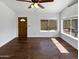 Bright living room with hardwood floors and a large window with natural light at 1805 E Bluefield Ave, Phoenix, AZ 85022