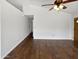 Bright living room features a ceiling fan and hardwood floors at 1805 E Bluefield Ave, Phoenix, AZ 85022